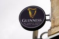 Guinness sign text and logo of irish beer on wall building restaurant pub bar Royalty Free Stock Photo