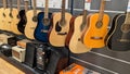 Guitars classic in music shop showcase with guitar hanging for sale Royalty Free Stock Photo