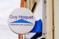 Guy hoquet sign text and logo brand of french real estate store broker office company