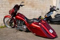 Harley-Davidson lowrider glide custom bagger motorcycle white parked in street Harley