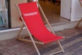 Havaianas logo sign and brand text in seat red beach canvas chair