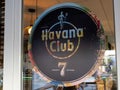 Havana Club 7 logo text and sign of white rum brand on door window entrance restaurant