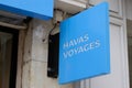 Havas voyages text and blue sign logo front of store office on holidays travel agency