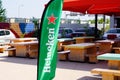 Heineken sign text and logo on green flag for dutch brewing company