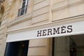 Hermes logo and text sign front of luxury brand store of French manufacturer HermÃÂ¨s