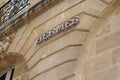 Hermes logo and text sign front of store building of French high fashion shop luxury