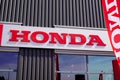 Honda logo brand store motorcycle sign text car dealership shop red colour flag Royalty Free Stock Photo