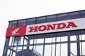 honda motorbike sign text on dealership store with motorcycle logo on red shop Royalty Free Stock Photo