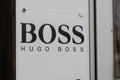 Hugo Boss logo text and brand sign of store German luxury fashion style house shop