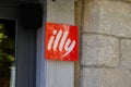 Illy coffee shop red sign brand and text logo cafe Italian coffee makers in wall