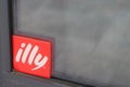 Illy coffee shop red sign logo cafe Italian coffee makers text brand on windows