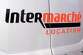 intermarche logo sign and text on location truck hire detail rent van supermarket car