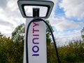 Ionity logo sign on charger station charging of vehicle electric car ve charger