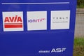 Ionity Tesla avia logo brand and text sign on charger station point of vehicle electric