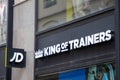 jd king of trainers logo brand and text on sporty shop facade wall sign in the main