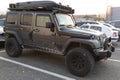 Jeep rubicon wrangler American off-road and raid equipped car with roof tent box