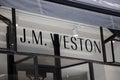 jm weston logo store and text sign front wall facade of shop fashion brand