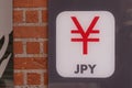 jpy Thin text brand badge with Japanese yen sign on change bank office agency wall