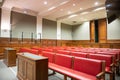 Judiciary courtroom in court of justice with witness desk and defense and prosecution Royalty Free Stock Photo