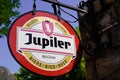 Jupiler logo brand and text sign of beer front facade wall of pub bar restaurant of