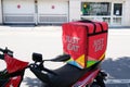 Just Eat logo and text sign on Hard Case Pannier on delivery scooter vehicle