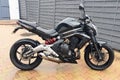 Kawasaki er6 n roadster black motorcycle parked outdoor Royalty Free Stock Photo