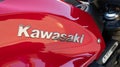 Kawasaki logo brand and text sign on Z900 motorcycle red petrol retro tank fuel Royalty Free Stock Photo