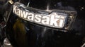 Kawasaki vintage text brand of motorcycle Classic sign logo on motorbike tank detail Royalty Free Stock Photo