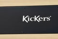 Kickers logo and text sign front of shop footwear and clothing