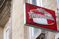 Kronenbourg logo and text sign of french beer front of pub bar restaurant wall
