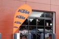 KTM motorbike logo and sign on orange flag front of motorcycle store dealership