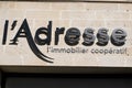 L`adresse logo and text sign front of office entrance in real estate company french Royalty Free Stock Photo