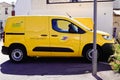 La Poste postman panel car van in French city with logo sign and brand text of France