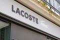 Lacoste brand logo closeup of shop sign text on store front boutique