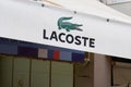 Lacoste logo sign and brand text store famous french chain of luxury polo sport