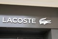 Lacoste sign and text logo front of store famous french chain of luxury polo sporty