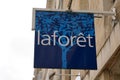 Laforet sign text and logo front of real estate shop broker office store