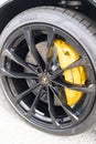 Lamborghini sign logo and brand text shape details black front wheel disk brake