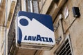 Lavazza logo brand and sign text of coffee wall bar building facade and entrance