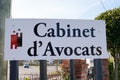 Lawyer cabinet d`avocats text sign and brand logo facade french on wall office counse Royalty Free Stock Photo