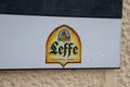 Leffe Belgian beer sign logo and brand text on wall entrance bar restaurant facade