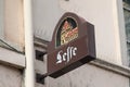 Leffe Belgian beer sign logo and brand text on wall entrance bar restaurant facade