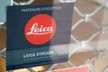 Leica eyecare dealer sign logo and brand text front of store glasses optic and camera