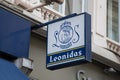 Leonidas logo brand and sign text facade wall chain shop entrance of Belgian