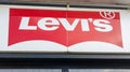 Levi`s brand logo and red sign text on facade shop fashion clothing levis store