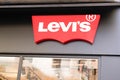 Levi`s text brand sign and red Logo front of us Jeans shop fashion boutique of clothin