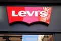 Levi`s text sign and red Logo front of Jeans shop fashion boutique of clothing brand