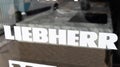 Liebherr logo brand and text sign on shop window Group of large equipment manufacturer