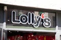 lollyÃ¢â¬â¢s candy bar sign text and brand logo shop wall facade Candies chocolate and