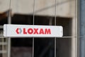 Loxam rent company text sign and logo red industry rental lifting equipment in